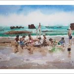 Niños jugando en la playa de Noja