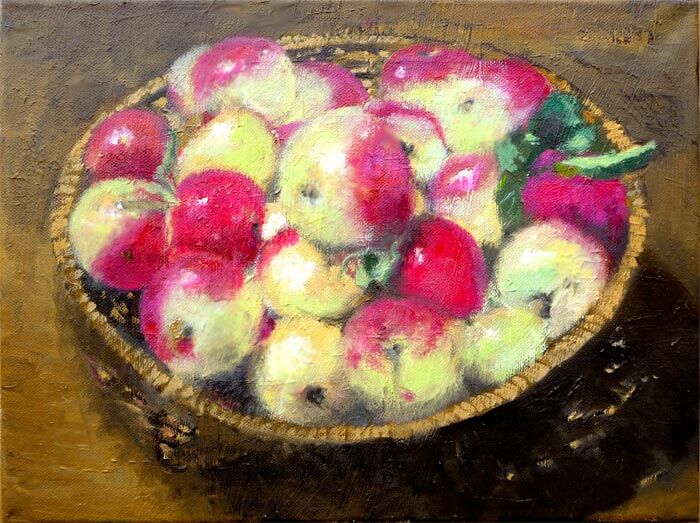 Bodegón de manzanas en una cesta